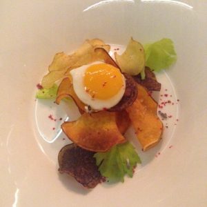 Amuse bouche: quail egg on root vegetables